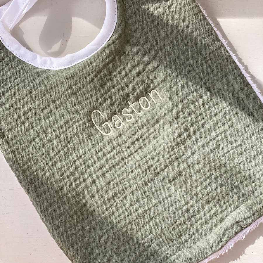 Personalized sage green bib close-up