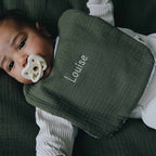 Baby with personalized fern bib