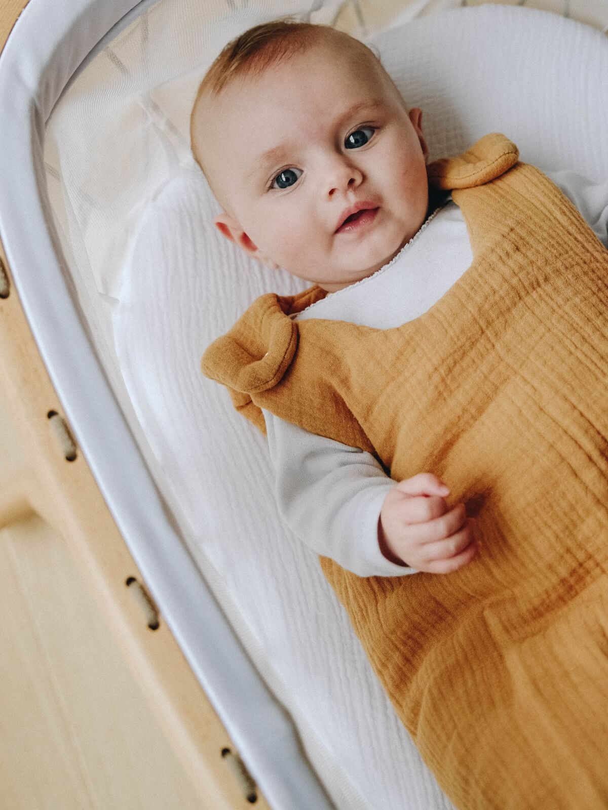 Baby with camel sleeping bag