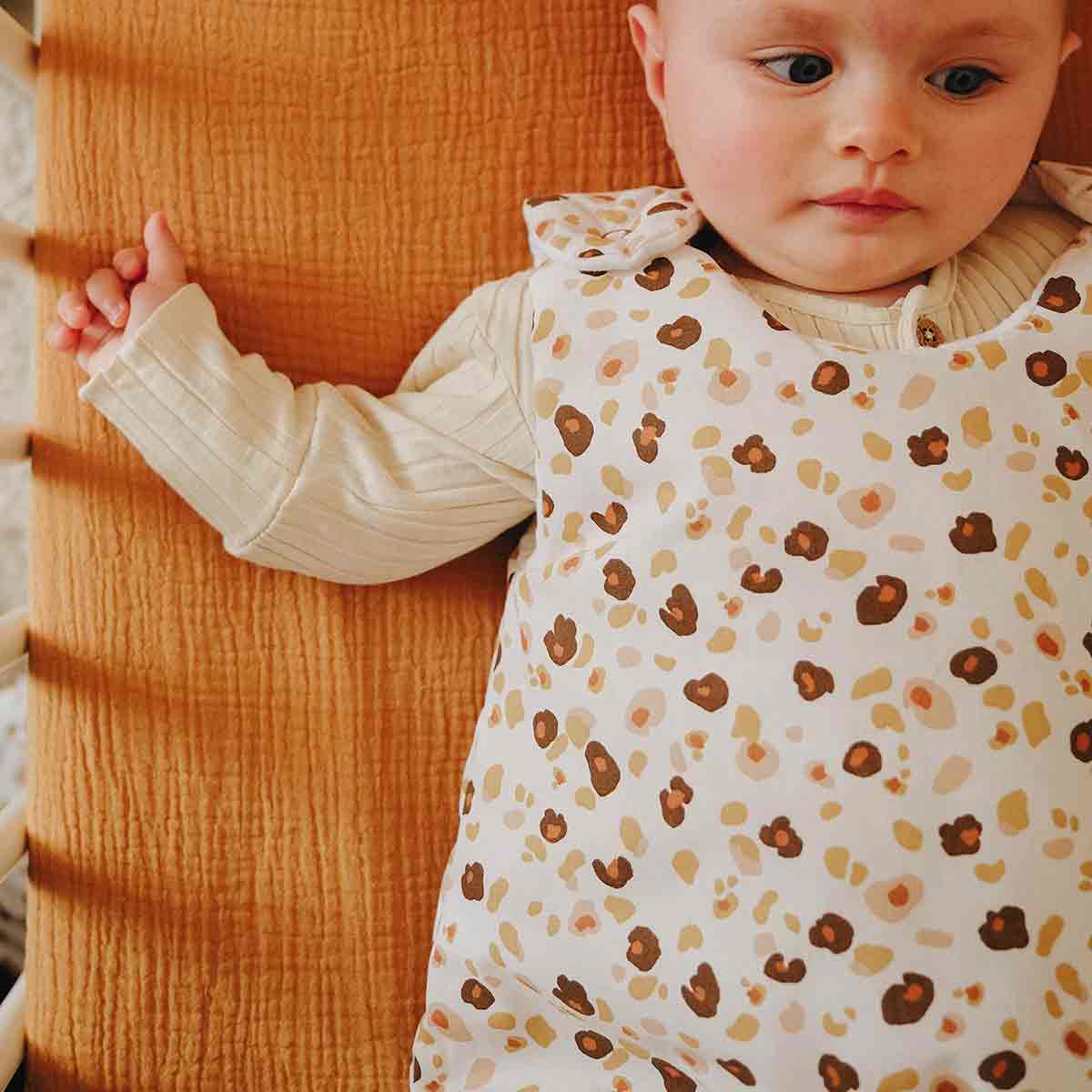 Baby with leopard print sleeping bag tog 2