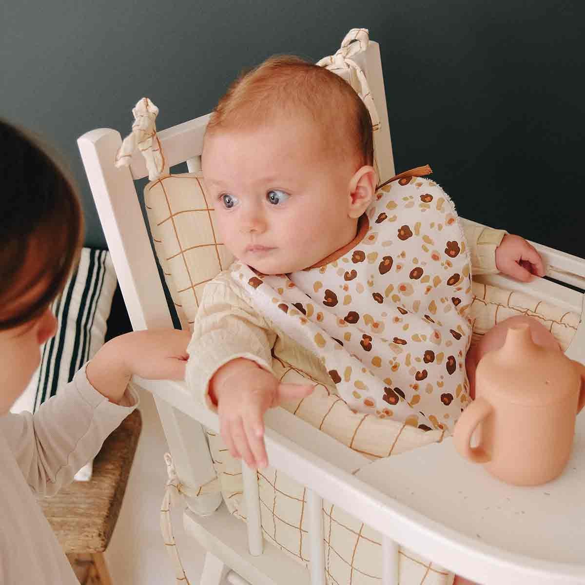 Baby with leopard bib