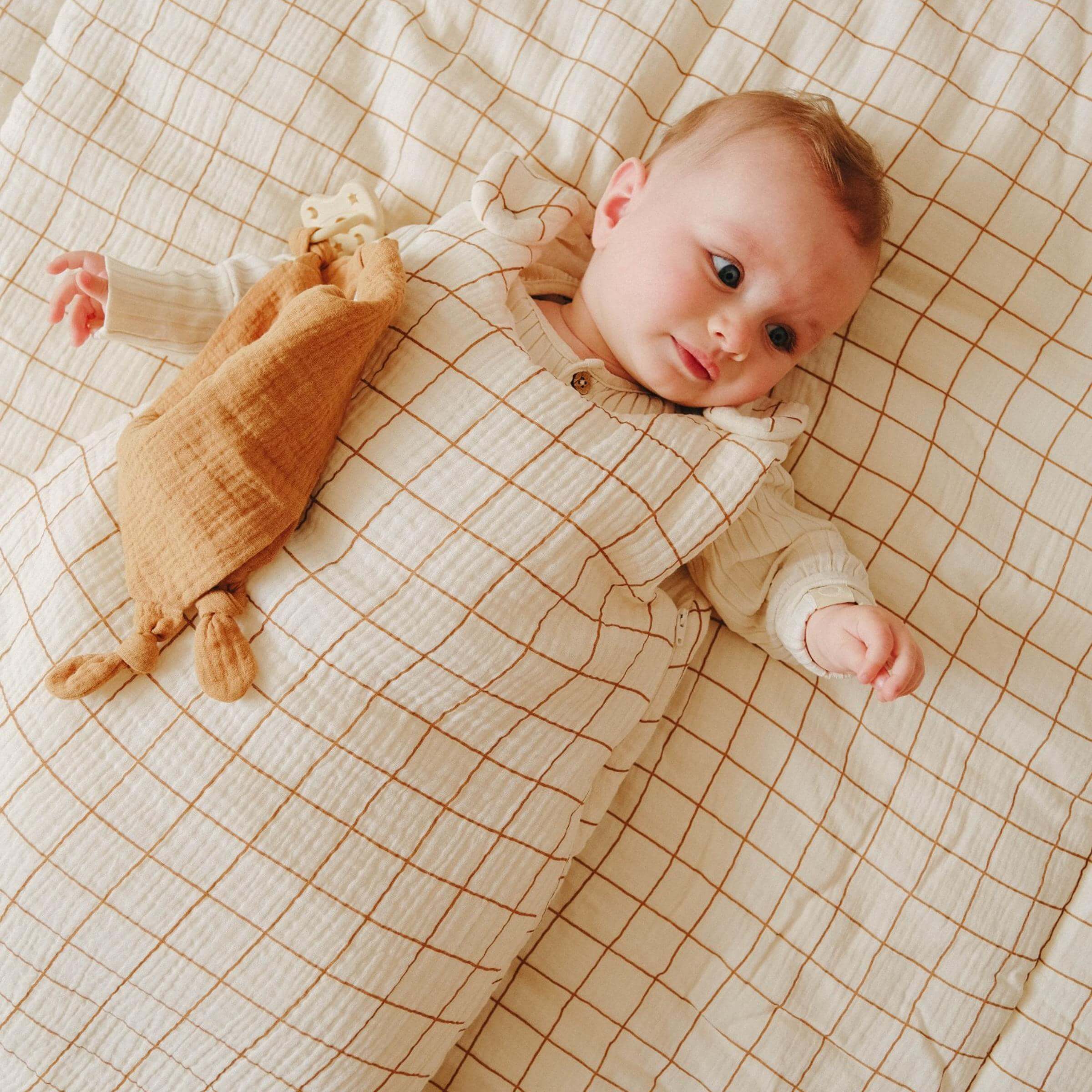 Baby in camel cotton gauze sleeping bag