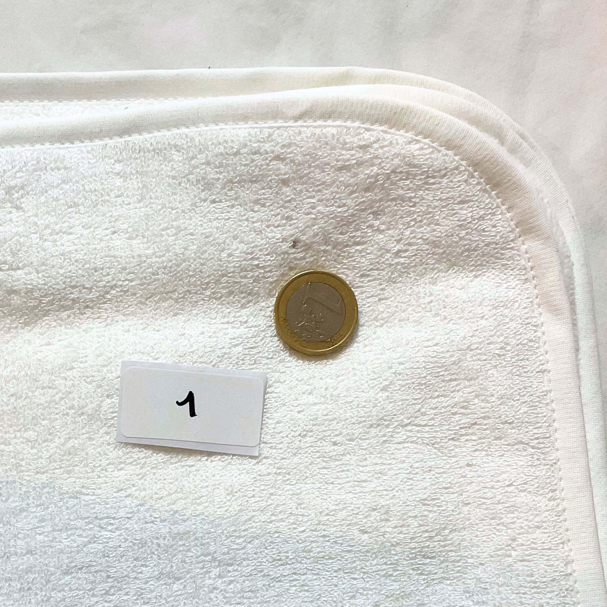 Focus on the flaw in the white 1 bath cape