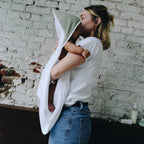 Baby and mom in a sage-green bathing apron