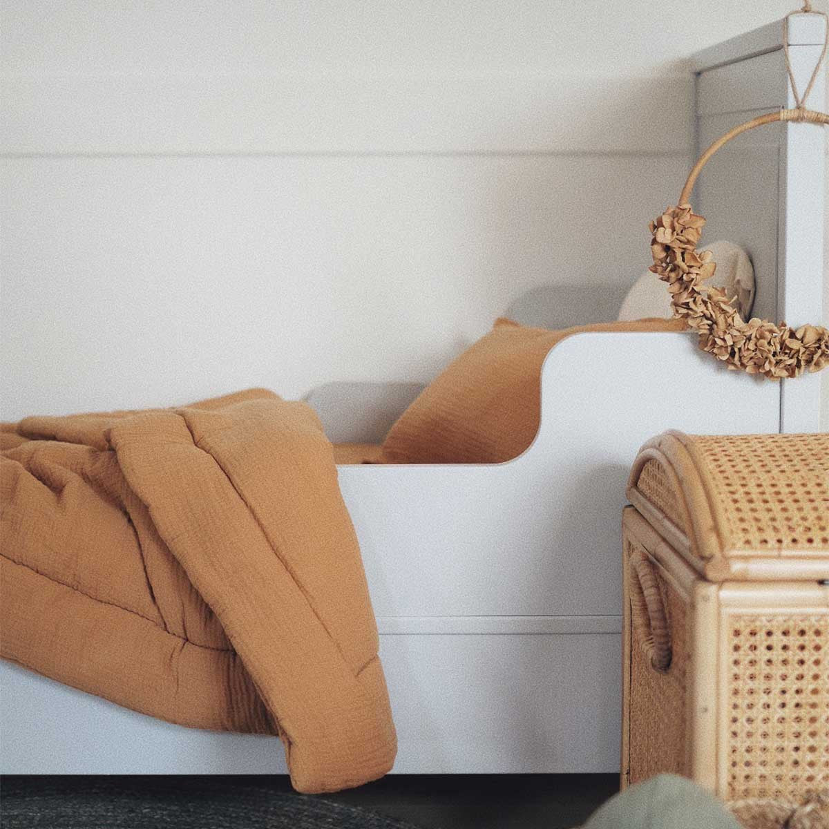 Camel baby bed comforter on a crib