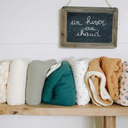 Polar blankets in different colors on a shelf