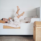 Child in bed with pear pattern comforter cover