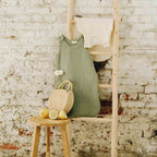 Green and ecru sleeping bag tog 1 in nursery