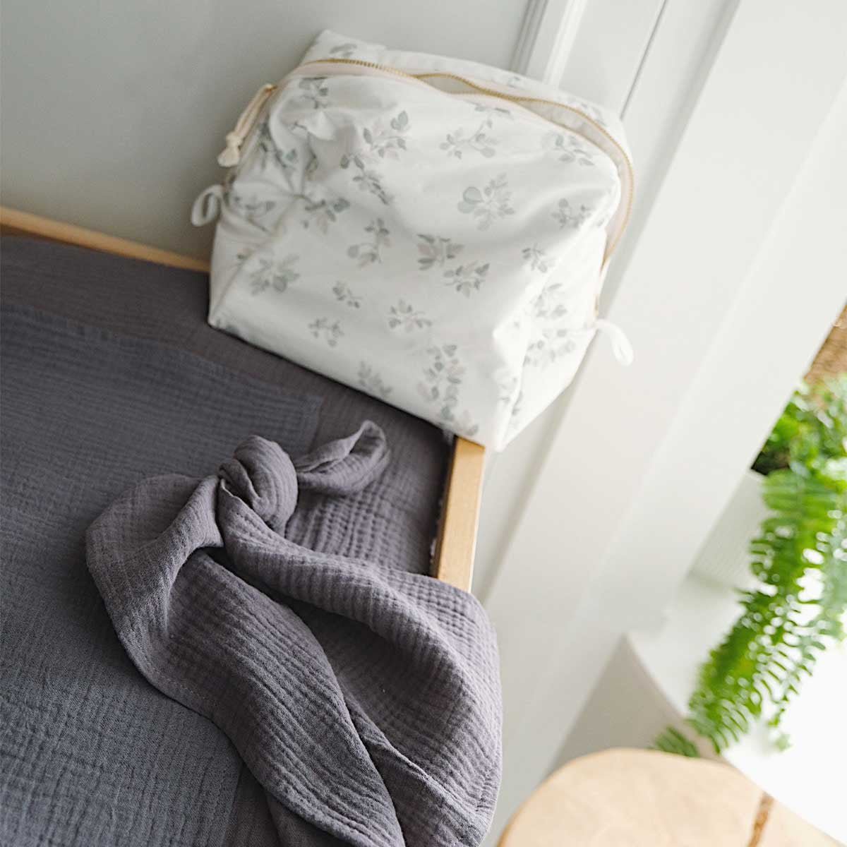 Dark grey cotton gauze changing mat cover, close-up view