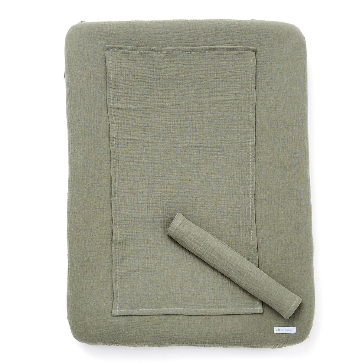 Changing mat cover in sage green cotton gauze