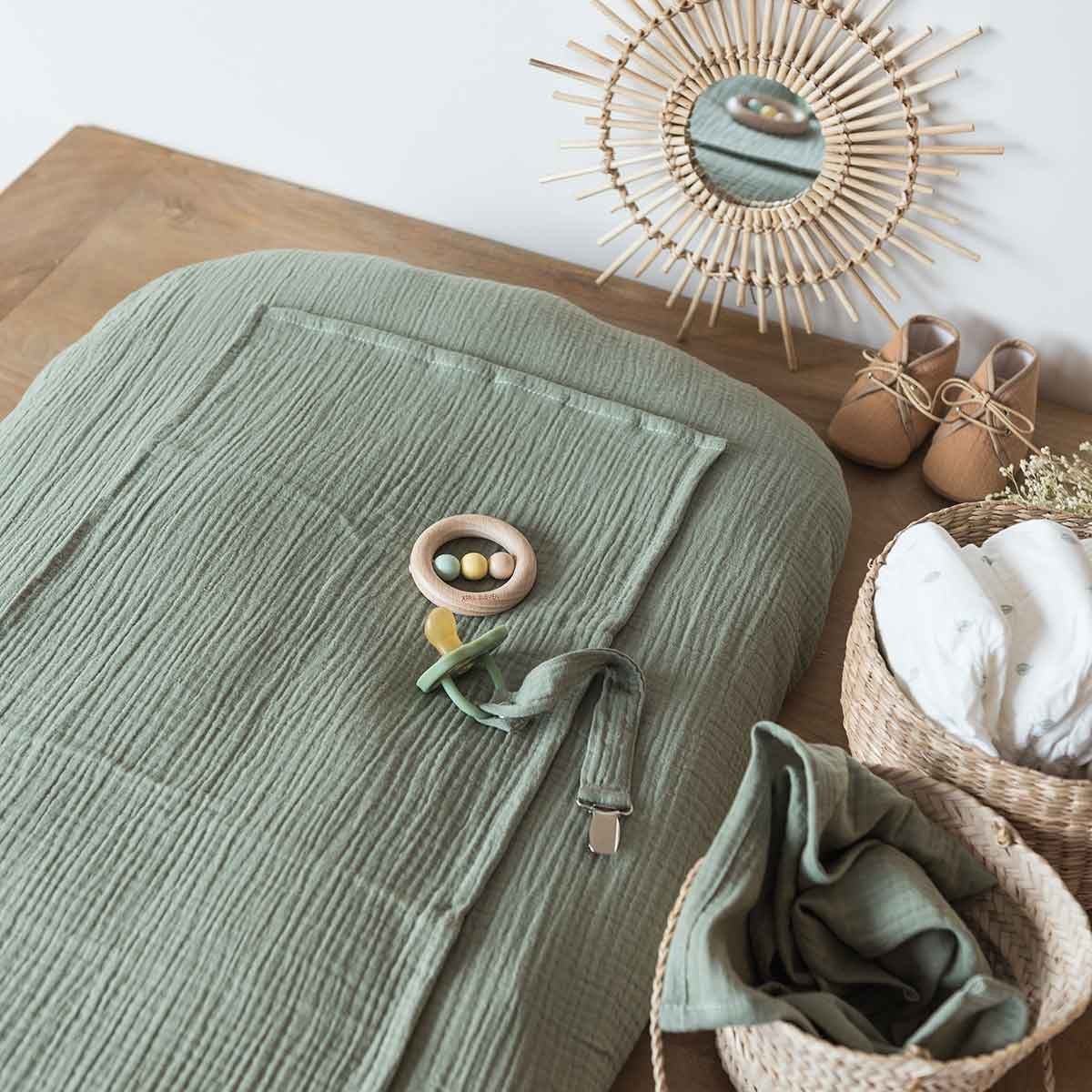 Sage green changing mat cover, close-up view