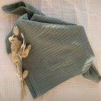 Close-up of sage green cotton gauze diaper