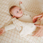 Mom and baby in a sleeping bag