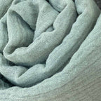 Maxi diaper in sage green cotton gauze, close-up view