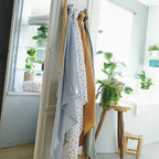 Maxis diapers suspended from a ladder