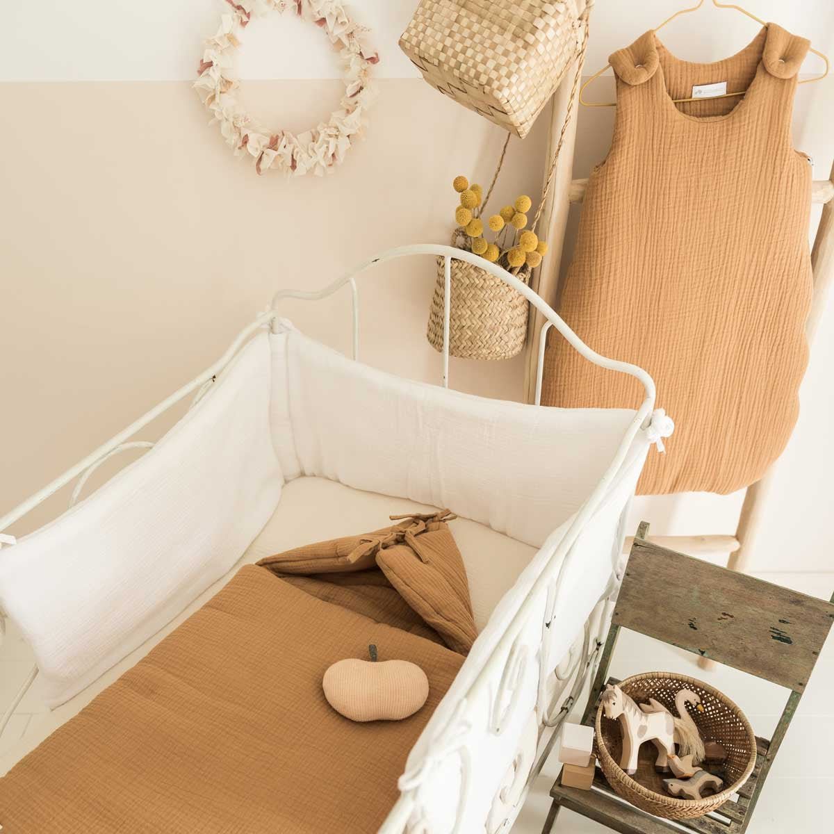 Angel's nest in camel cotton gauze in a bed