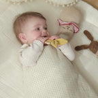 baby in vanilla cotton gauze sleeping bag