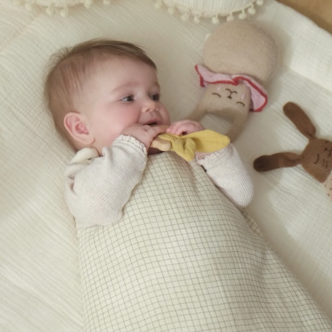 baby in vanilla cotton gauze sleeping bag