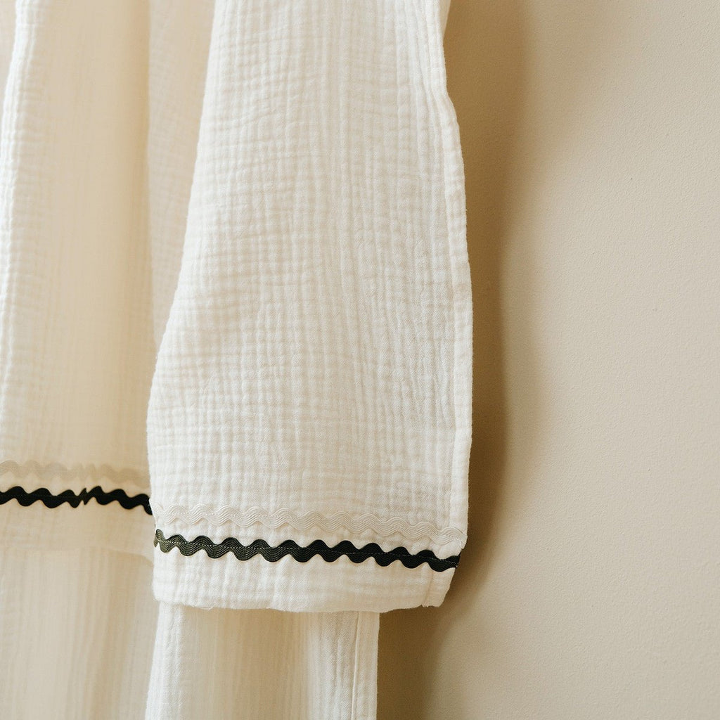 Focus on the finishes of the khaki ecru cotton gauze curtain