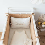 Camel bumper in a cot