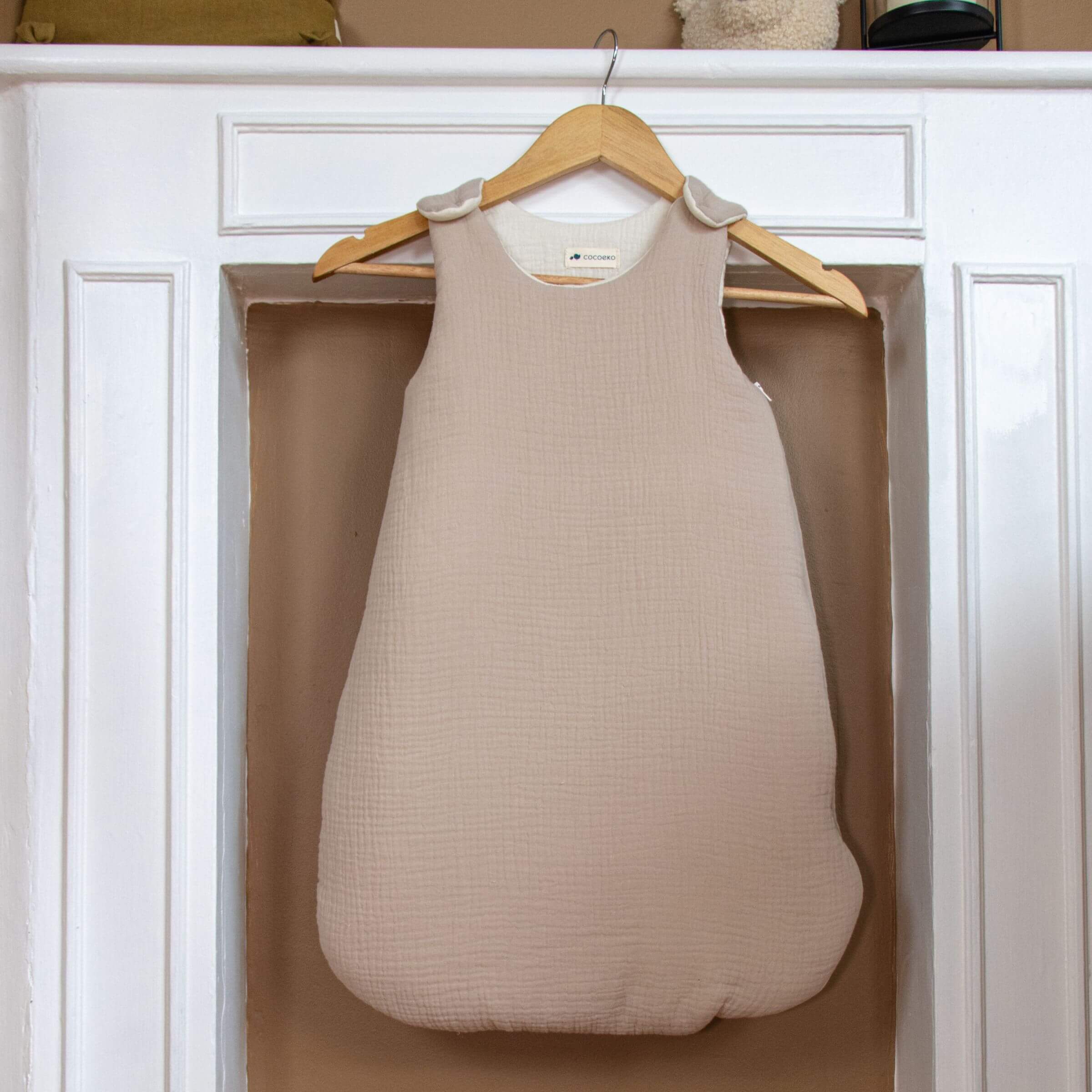 Beige cotton gauze baby sleeping bag tog 2 in a nursery