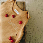 Personalized summer sleeping bag in camel cotton gauze, close-up view