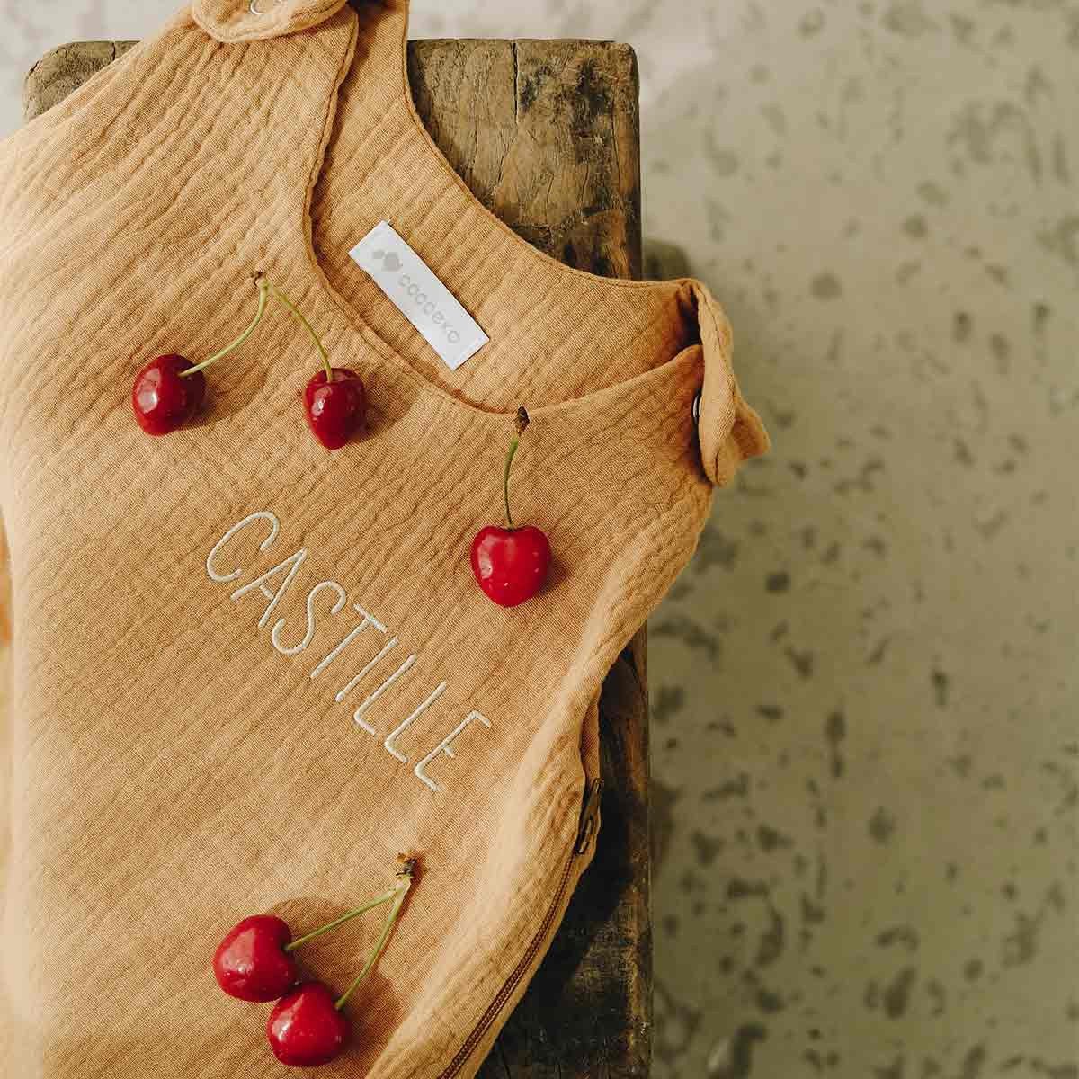 Personalized summer sleeping bag in camel cotton gauze, close-up view